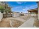 Backyard featuring a storage shed, concrete pathway, and room for personalized landscaping at 1115 Pearl Marble Ave, North Las Vegas, NV 89081