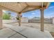 Spacious backyard featuring a covered patio, a storage shed, and ample open space for landscaping at 1115 Pearl Marble Ave, North Las Vegas, NV 89081