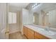 Bathroom with a sink, large mirror, and neutral walls and tile floors at 1115 Pearl Marble Ave, North Las Vegas, NV 89081