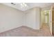 Bedroom with neutral walls, carpet, a ceiling fan, and double closets at 1115 Pearl Marble Ave, North Las Vegas, NV 89081