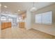 Bright kitchen and breakfast nook with tile floors and natural wood cabinets and modern appliances at 1115 Pearl Marble Ave, North Las Vegas, NV 89081