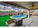 Inviting backyard boasts a pristine pool, comfortable seating, and a patio area perfect for outdoor entertaining at 11157 Mezzana St, Las Vegas, NV 89141