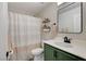 Bathroom featuring decorative shelves, striped shower curtain, and modern fixtures at 11157 Mezzana St, Las Vegas, NV 89141