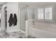 Bathroom featuring a built-in tub and a glass-enclosed shower at 11157 Mezzana St, Las Vegas, NV 89141