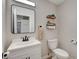 Cozy bathroom features a sleek vanity, decorative shelves, and modern fixtures at 11157 Mezzana St, Las Vegas, NV 89141