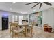 Inviting dining area offers a round wooden table, comfortable seating, and views of the spacious open-concept layout at 11157 Mezzana St, Las Vegas, NV 89141