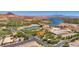 Expansive aerial shot of community featuring lake, golf course, and Mediterranean-style buildings at 2 Cerchio Centrale, Henderson, NV 89011