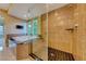 Modern bathroom showcasing a glass shower enclosure, soaking tub, and sleek fixtures at 2 Cerchio Centrale, Henderson, NV 89011
