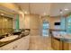 Luxurious bathroom with dual sinks, soaking tub, and glass-enclosed shower at 2 Cerchio Centrale, Henderson, NV 89011