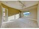Open bedroom with plush carpeting, mountain views, a ceiling fan, and ensuite access at 2 Cerchio Centrale, Henderson, NV 89011