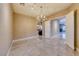 Bright dining room featuring marble floors, modern chandelier, and open floor plan at 2 Cerchio Centrale, Henderson, NV 89011