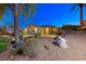 Attractive home exterior with desert landscaping featuring mature trees and a well maintained front yard at 2 Cerchio Centrale, Henderson, NV 89011