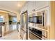 Kitchen featuring stainless steel appliances, granite counters, and custom cabinetry at 2 Cerchio Centrale, Henderson, NV 89011