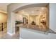Open kitchen featuring custom cabinets, granite counters, and a breakfast bar overlooking the living area at 2 Cerchio Centrale, Henderson, NV 89011
