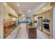 Updated kitchen features granite countertops, stainless steel appliances, and a center island at 2 Cerchio Centrale, Henderson, NV 89011