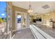 Elegant living room featuring marble floors, a fireplace, built-in shelving, and doors to outdoor patio at 2 Cerchio Centrale, Henderson, NV 89011