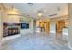 Spacious living room with fireplace, marble floors, built-in shelving, and recessed lighting at 2 Cerchio Centrale, Henderson, NV 89011