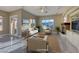 Staged living room with marble floors, fireplace, and large windows offering stunning views at 2 Cerchio Centrale, Henderson, NV 89011