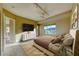 Bedroom staged with bed, furnishings, and large windows showcasing views at 2 Cerchio Centrale, Henderson, NV 89011