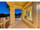 Covered patio area, perfect for outdoor seating and enjoying the scenic views at twilight at 2 Cerchio Centrale, Henderson, NV 89011
