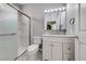 Bathroom featuring a new vanity, light fixture, and shower with frosted glass door at 2050 W Warm Springs Rd # 712, Henderson, NV 89014