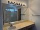 Bathroom vanity with a large mirror and vanity lighting at 2118 Chapman Ranch Dr, Henderson, NV 89012