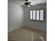 Bedroom with neutral carpet and plantation shutters allowing natural light at 2118 Chapman Ranch Dr, Henderson, NV 89012