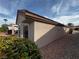 Home exterior view showcasing stucco siding and well-maintained desert landscaping at 2118 Chapman Ranch Dr, Henderson, NV 89012