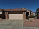 Single-story home with a two-car garage, complemented by desert landscaping for low maintenance at 2118 Chapman Ranch Dr, Henderson, NV 89012