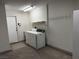 Garage featuring a washer/dryer, utility sink and storage, perfect for projects at 2118 Chapman Ranch Dr, Henderson, NV 89012