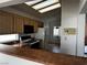 Bright kitchen showcasing wood cabinets, black appliances, and a functional layout with a cozy breakfast bar at 2118 Chapman Ranch Dr, Henderson, NV 89012