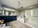 Bathroom featuring a large shower, a bathtub and vanity area at 2204 Valdina St, Henderson, NV 89044