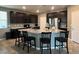 The kitchen features a spacious island, stainless steel appliances and granite countertops at 2204 Valdina St, Henderson, NV 89044