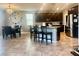 Bright kitchen features a central island with bar seating, modern appliances, and open layout to dining space at 2204 Valdina St, Henderson, NV 89044
