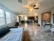 Expansive open-concept living area with tile floors, great natural light, connecting kitchen and dining zones at 2204 Valdina St, Henderson, NV 89044