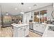 Open kitchen features a center island, stainless steel appliances, and a view into the living area at 2250 Tedesca Dr, Henderson, NV 89052