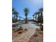 Gated entrance with palm trees and desert landscaping at 2300 E Silverado Ranch Blvd # 2074, Las Vegas, NV 89183