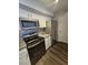 Bright kitchen featuring stainless steel appliances, gray countertops, and stylish mosaic backsplash at 2300 E Silverado Ranch Blvd # 2074, Las Vegas, NV 89183