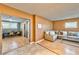 Living room open to dining area featuring wood and tile flooring at 247 Tungsten St, Henderson, NV 89015