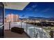 Balcony view of city at night from glass railing at 2700 Las Vegas Blvd # 1002, Las Vegas, NV 89109