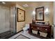 Elegant bathroom with a glass shower, granite countertops, and modern fixtures at 2700 Las Vegas Blvd # 1002, Las Vegas, NV 89109