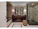 Bathroom featuring double sinks, stone shower, and modern finishes at 2700 Las Vegas Blvd # 1002, Las Vegas, NV 89109