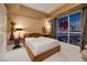 Bedroom showcasing a king bed with city views at night at 2700 Las Vegas Blvd # 1002, Las Vegas, NV 89109