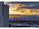 Expansive city view showcasing hotel and desert mountain range in the distance during a stunning sunset at 2700 Las Vegas Blvd # 1002, Las Vegas, NV 89109
