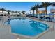 Large swimming pool with lounge chairs and clear blue water on a sunny day at 2700 Las Vegas Blvd # 1002, Las Vegas, NV 89109