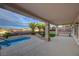 The backyard features a covered patio, in-ground pool, and desert landscaping perfect for relaxing at 2820 Thunder Bay Ave, Henderson, NV 89052