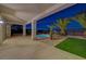 Inviting backyard features a covered patio, pool, mature palm trees, and a low-maintenance desert landscape at 2820 Thunder Bay Ave, Henderson, NV 89052