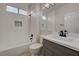 Modern bathroom featuring a shower and tub combination and a sink with gray cabinetry at 2820 Thunder Bay Ave, Henderson, NV 89052
