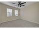 Cozy bedroom with carpeting and a ceiling fan. The windows provide natural light at 2820 Thunder Bay Ave, Henderson, NV 89052