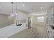 Modern kitchen with stainless steel appliances, stylish pendant lights, and quartz countertop island at 2820 Thunder Bay Ave, Henderson, NV 89052